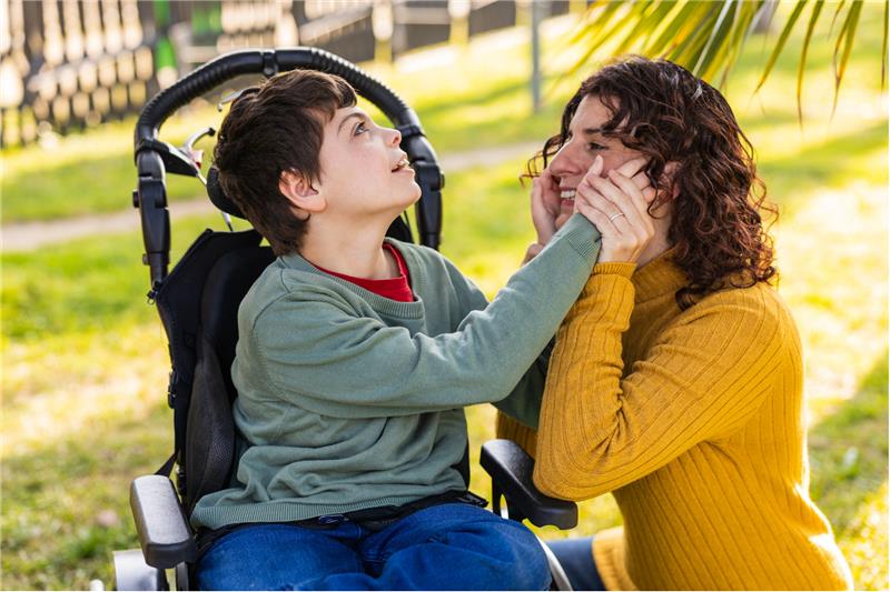 Canva disabled child with female carer